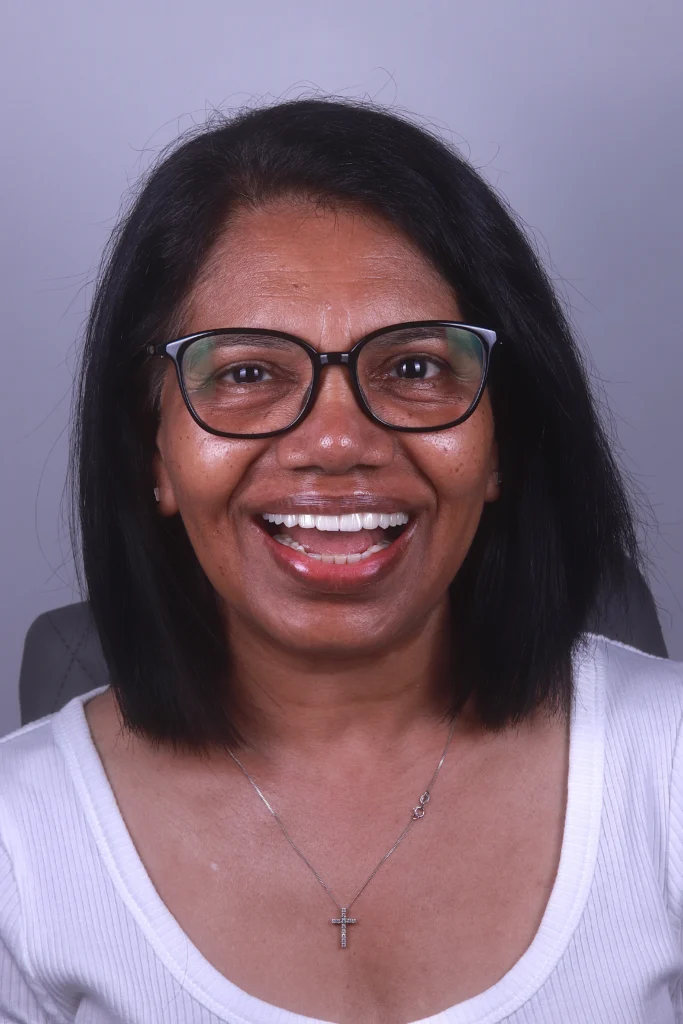 Woman smiling after a single dental implant
